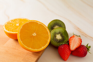 fresh fruits orange, kiwi fruit, strawberry.