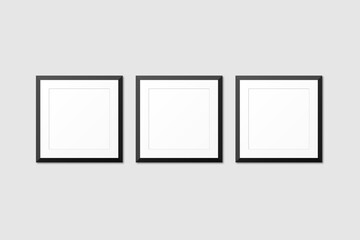 realistic blank frames mockup hanging on wall