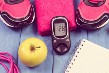Glucometer for checking sugar level, sport shoes and accessories for fitness. Diabetes and healthy...