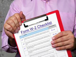 Conceptual photo about Form W-2 Checklist with handwritten phrase.
