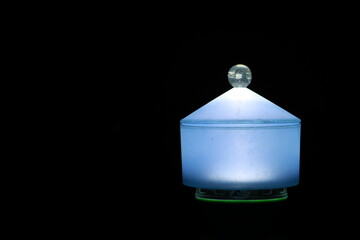 Close up Transparent Blue plastic box on black background