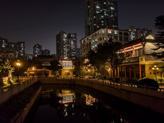 Fototapeta na wymiar Canal in the Chinese ancient style park night shot