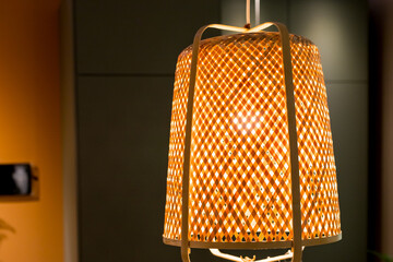 Decorating hanging lantern lamps in wooden wicker made from bamboo.Beige boho interior of living...