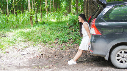 portrait of happy asian woman travelling in back car