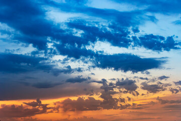 Sunset sky with multicolor clouds. Dramatic sky at sunset.
