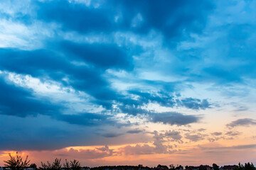 Obraz premium Sunset sky with multicolor clouds. Dramatic sky at sunset.