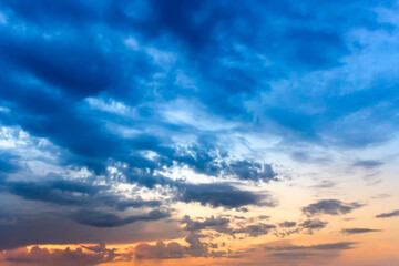 Sunset sky with multicolor clouds. Dramatic sky at sunset.