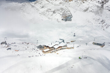 Aerial droe shot of Sonnalpin station restaurant in heavy snow below Zugspitze Top of Germany