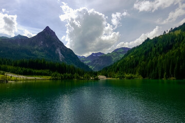 little waves on the surface of a mountain lake in a mountain valley