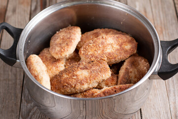 Fried cutlets in a saucepan. Homemade cutlets, diet food