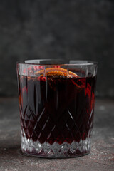 Aromatic mulled red wine on grey table.