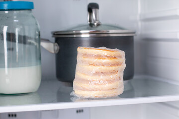 Frozen pancakes in the refrigerator. Ready frozen food