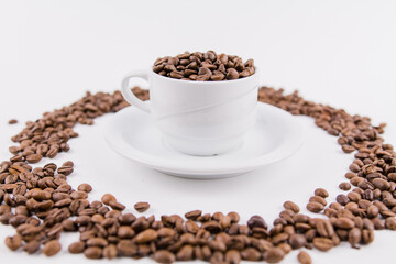 coffee cup with coffee beans on white background