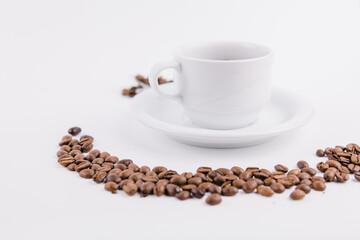 coffee cup with coffee beans on white background
