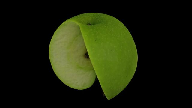 Realistic render of a rotating green Granny Smith apple with a slice cut out on black background. The video is seamlessly looping, and the 3D object is scanned from a real apple.
