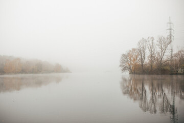 Misty lake. Autumn morning with fog