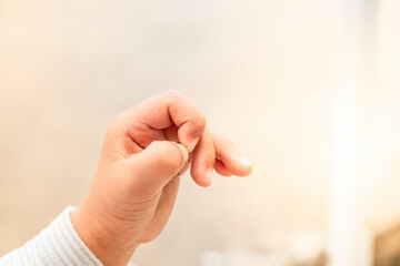Obraz premium baby's hand in white bright background