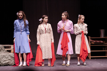 actress girls plays a retro lyrical performance of the show on the stage of the theater