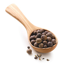Allspice in a wooden spoon isolated on white background