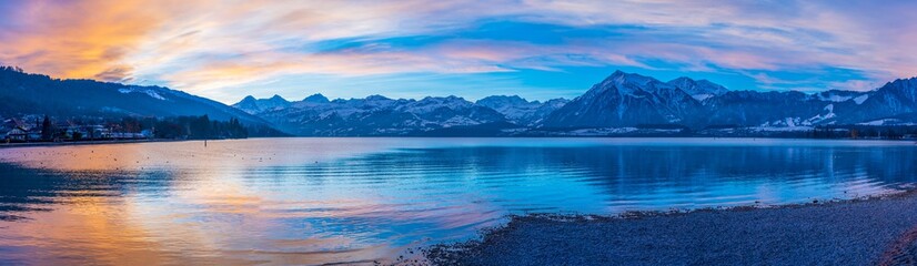 sunset over the lake in the swiss alps
