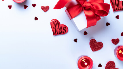 Valentines day gift box, red love hearts, romantic candle on white background. Romantic message template with copy space. Top View. View from above.