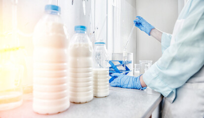 Quality control test of milk in laboratory. Dairy factory industry products