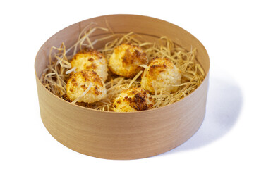 Homemade coconut macaroons coconut meringue cookies, traditional German Christmas cookies Kokosmakronen, wooden basket