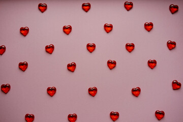 pattern of pink hearts evenly laid out on a pink background. Valentine's Day
