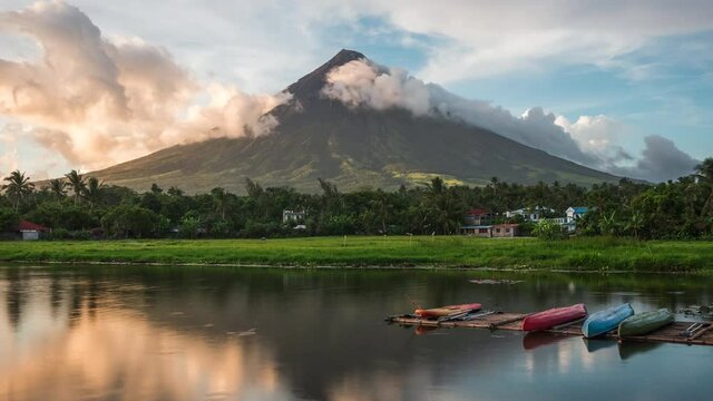 Legazpi, Albay, Philippines, time lapse view of Mount Mayon Volcano and Sumlang Lake at sunset.
