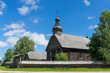 Fototapeta na wymiar Wooden Orthodox Church - an example of old Belarusian wooden architecture