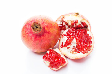 Ripe red pomegranate isolated on a white background