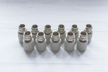 Combined couplings for connecting metal and polypropylene water pipes