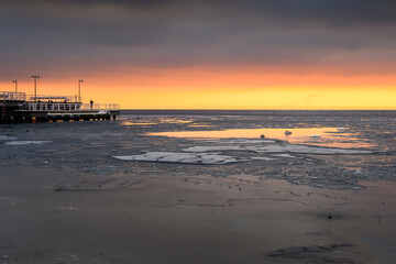 Beach in Jastarnia village on Hel Peninsula at sunset time. Winter landscape. Poland.