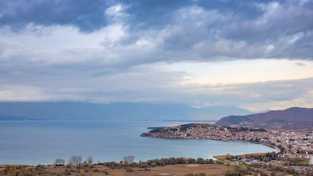Ohrid lake and old town, areal panorama on sunset. 4K Timelapse video.