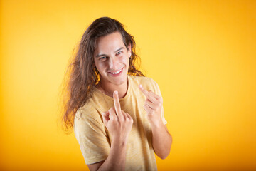 man shows the middle finger making you bad expression, provocation and rude attitude. screaming...