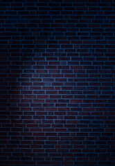 Fototapeta na wymiar Dark brick wall background with a bringt spotlight