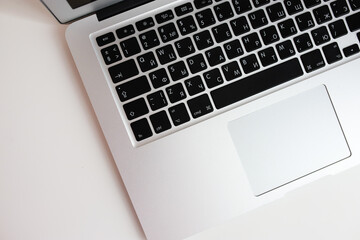 laptop with keyboard on white desktop