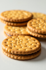 Sandwich biscuits cookies with chocolate filling on white background. Crackers with cream