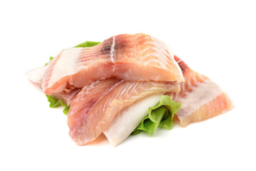 Pangasius fish fillet, pieces on a green lettuce leaf. Isolated on a white background. Fresh Fish Fillet.