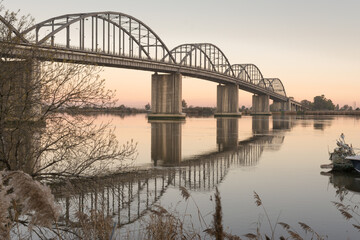 Old bridge over the river with reflections on the water, Marechal Carmona, Vila Franca Xira