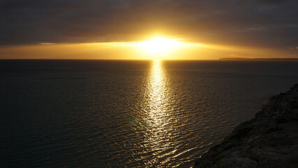 Sunset over the ocean at Shark Bay between Exmouth and Perth in Western Australia.
