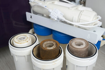 Dirty water filter cartridge used . Domestic water osmosis system at kitchen. Ecology, clean water,...