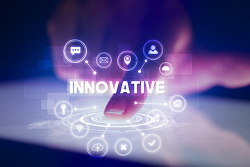 Finger touching tablet with web technology icons and INNOVATIVE inscription, web technology concept