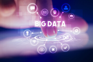 Finger touching tablet with web technology icons and BIG DATA inscription, web technology concept