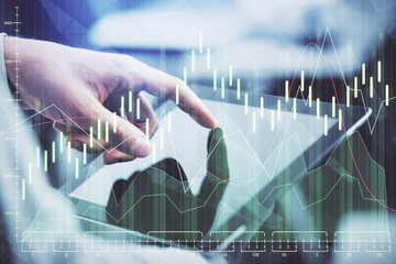 Multi exposure of man's hands holding and using a phone and financial chart drawing. Market analysis concept.