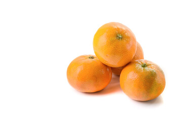 Ripe tangerines on a white isolated background.