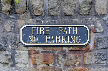 Close Up of Public Sign 'Fire Path No Parking' 