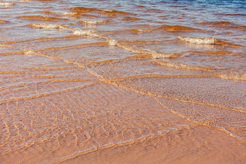 Soft wave of blue ocean on sandy beach