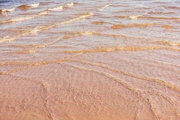 Soft wave of blue ocean on sandy beach