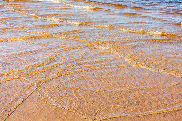 Soft wave of blue ocean on sandy beach